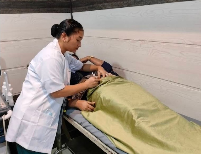 Doctor performing ultrasound scan for expectant mother